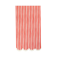 Single red and white striped paper dinner napkin with scalloped edge