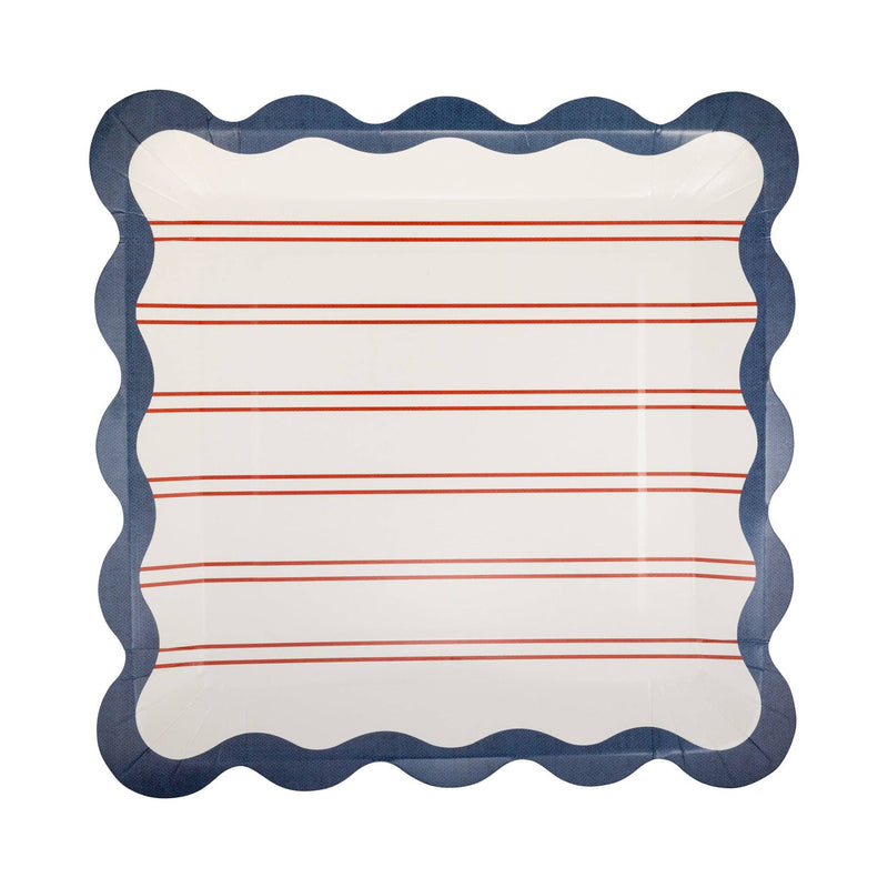 Red striped scalloped paper dinner plate close-up showing ticking stripe detail and navy scalloped edge on white background