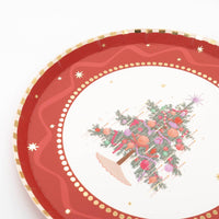 Close-up of the tree dessert plate showing the red border, gold-dot rim, and decorated tree.