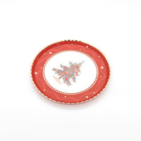 Red tree dessert plate shown flat on a white background.