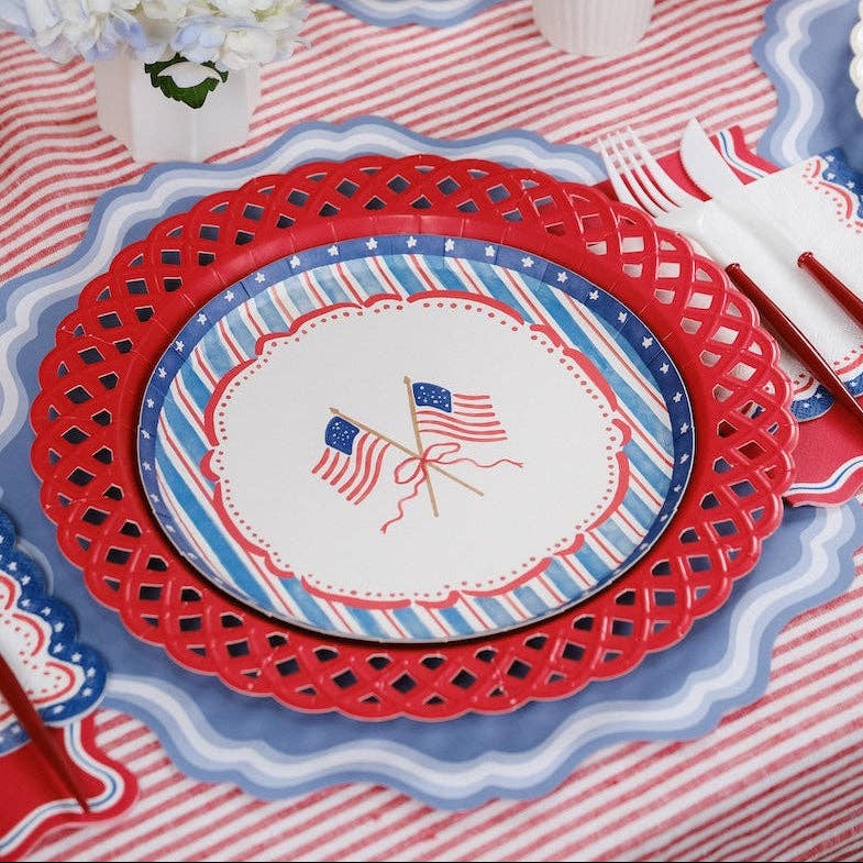 Americana Party Supplies featuring a red latticed charger and a flag-themed dinner plate.