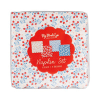 Front of floral cocktail napkin set packaging showing berry vine design with red scalloped label reading napkin set 6 each 4 designs