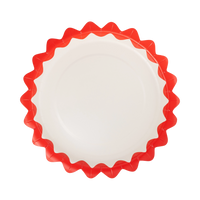 Cream round paper plate with a bold red zig-zag edge on a white background.