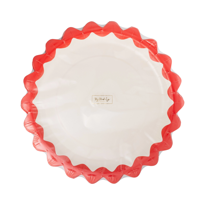 Cream paper plate with a red zig-zag edge shown at a slight angle.