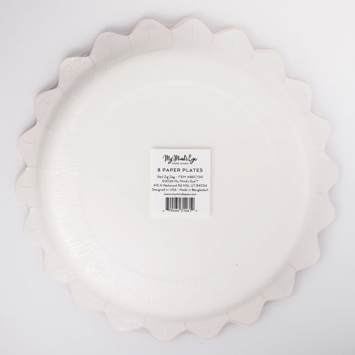 Back of the cream zig-zag-edge plate showing the round shape and product label.