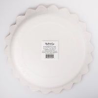 Back of the cream zig-zag-edge plate showing the round shape and product label.