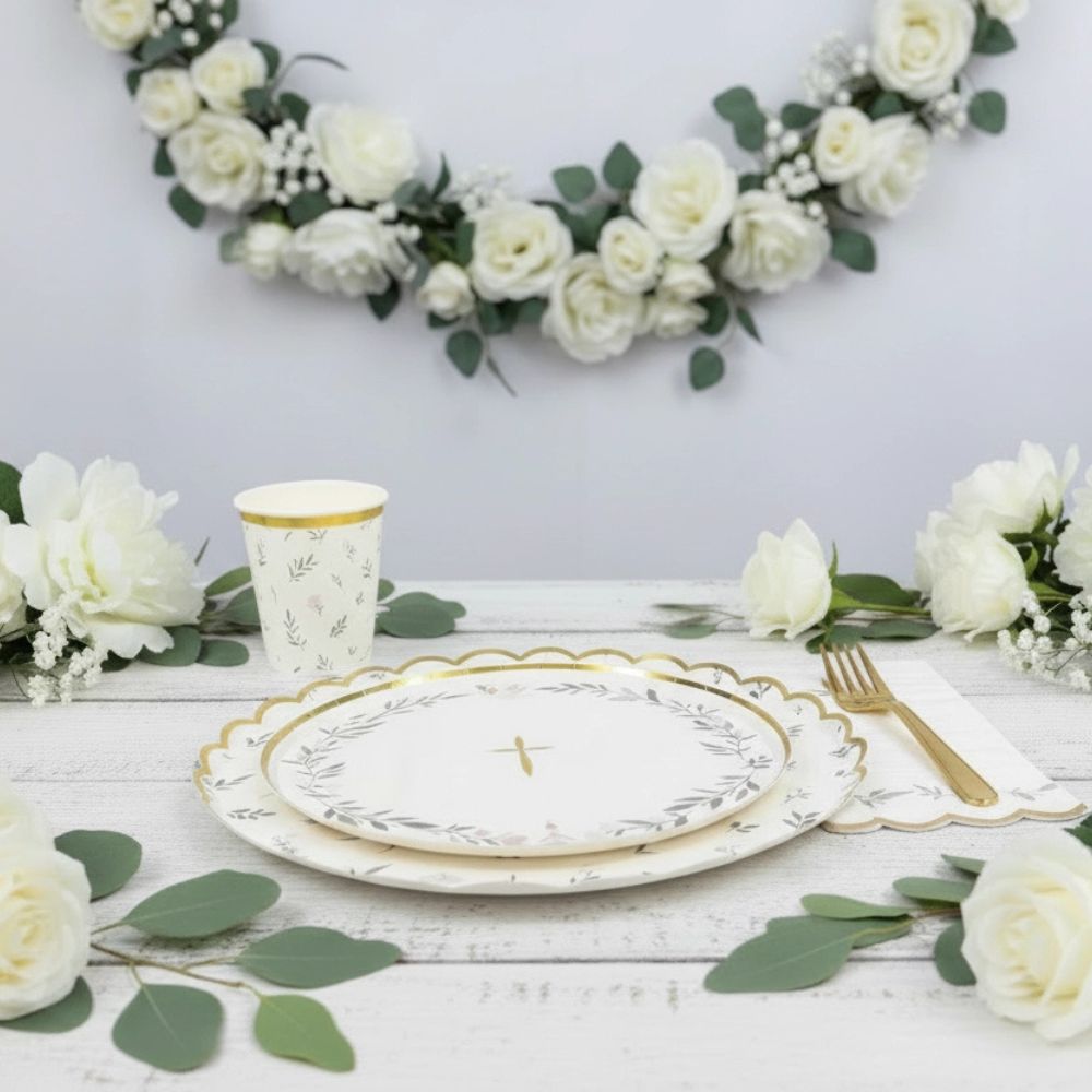 religious table setting with scalloped napkins and greenery decor
