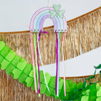 Ribbon rainbow craft with colorful ribbons hanging for St. Patrick’s Day décor