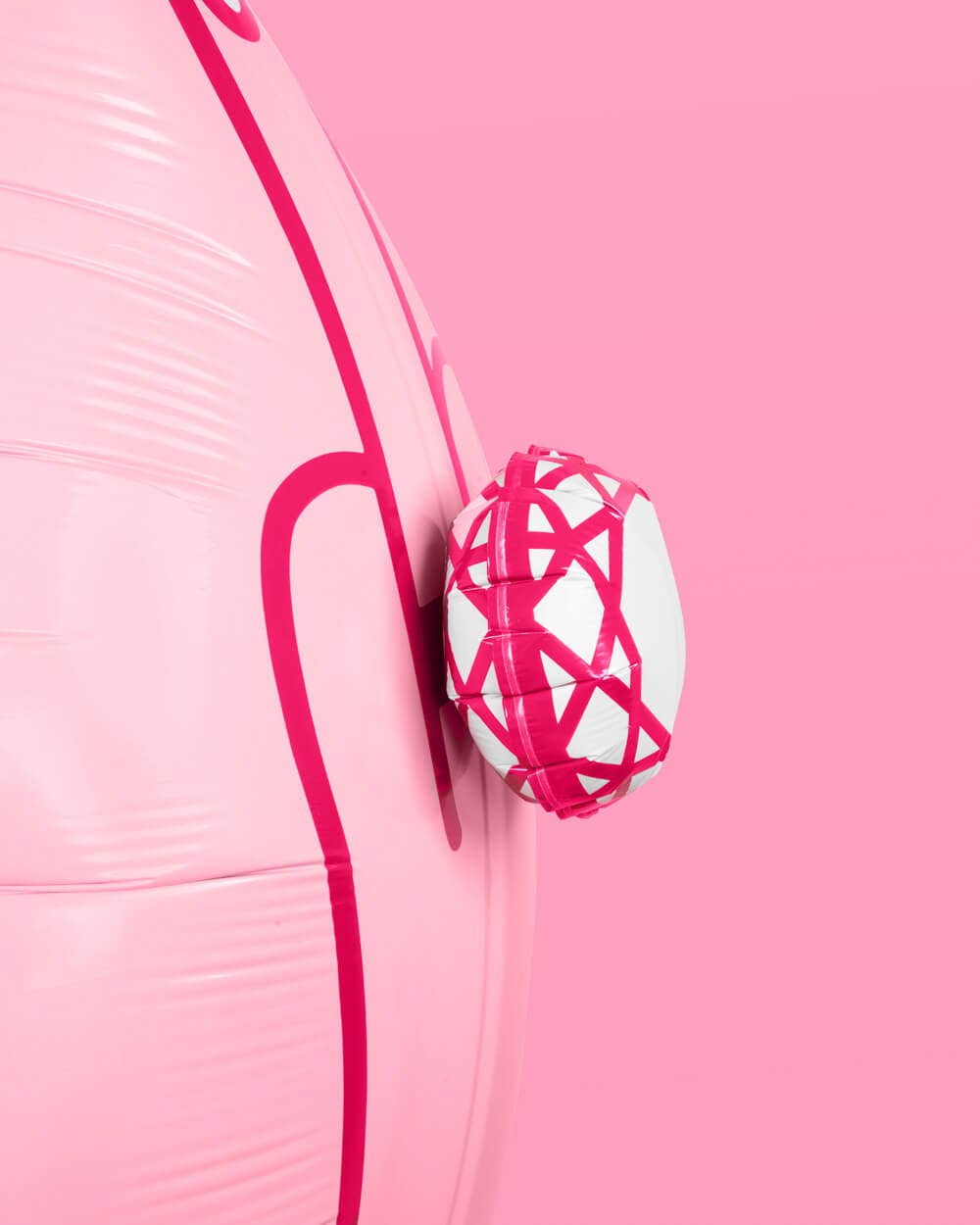 Close-up detail of 3D diamond ring on pink ring finger mylar balloon showing white and hot pink faceted design