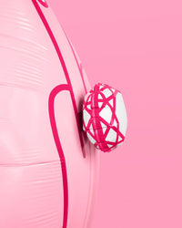 Close-up detail of 3D diamond ring on pink ring finger mylar balloon showing white and hot pink faceted design