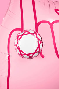 Extreme close-up of 3D diamond ring detail on ring finger balloon showing white and hot pink geometric facets