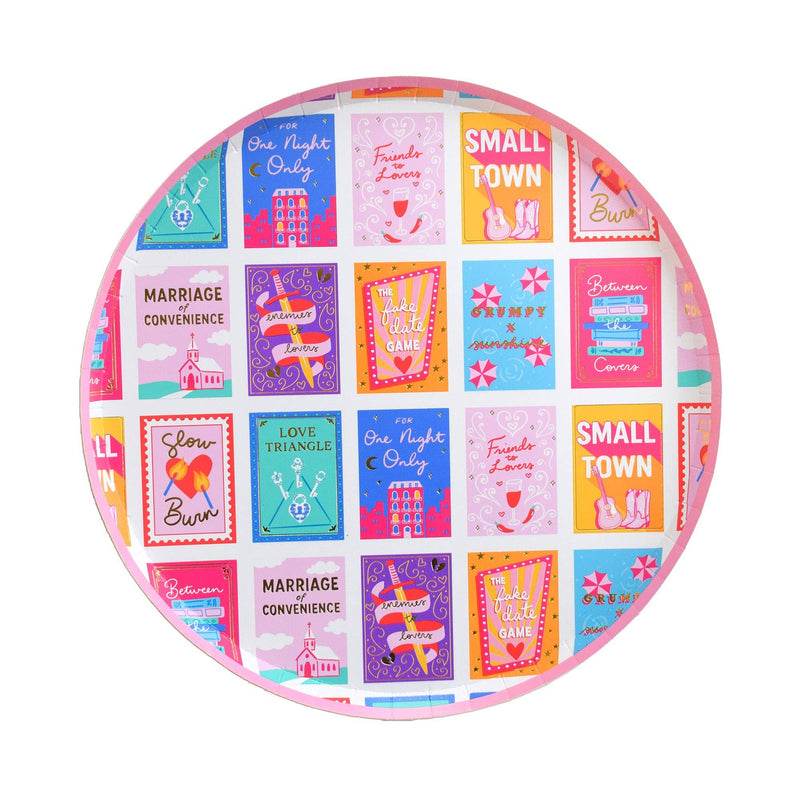 Pink romcom dinner plate with colorful book cover illustrations and gold rim