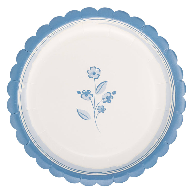 Round blue floral Easter paper plate with scalloped edge on white background.