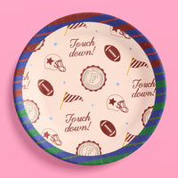 Round varsity football party plate with touchdown and helmet print