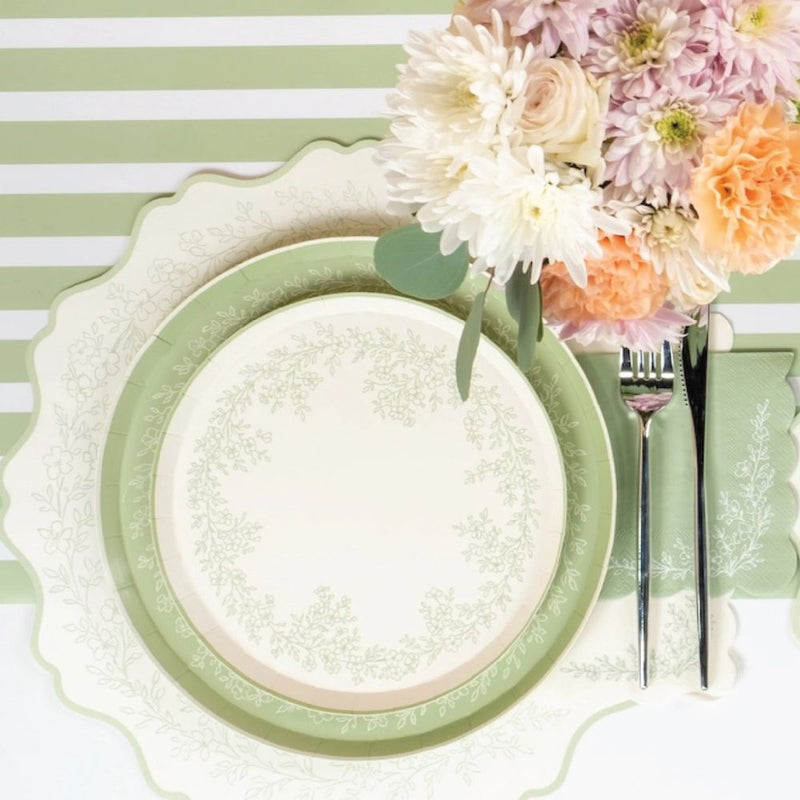sage floral napkins styled with plates and table setting.