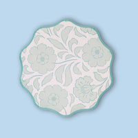 Single sage-green block-print floral scalloped paper plate on a light blue background.
