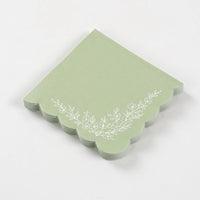 sage napkins stacked showing layered scalloped edges.