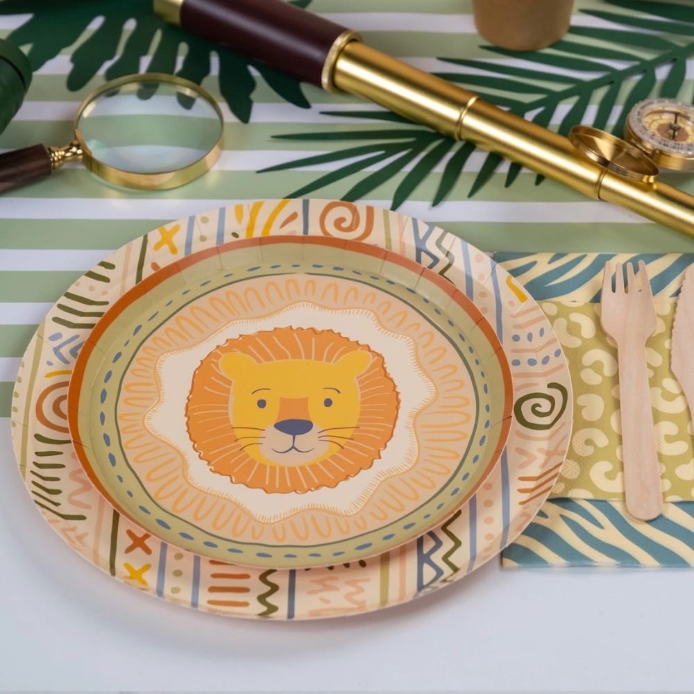 sage green striped table runner with safari themed place setting and lion plate.