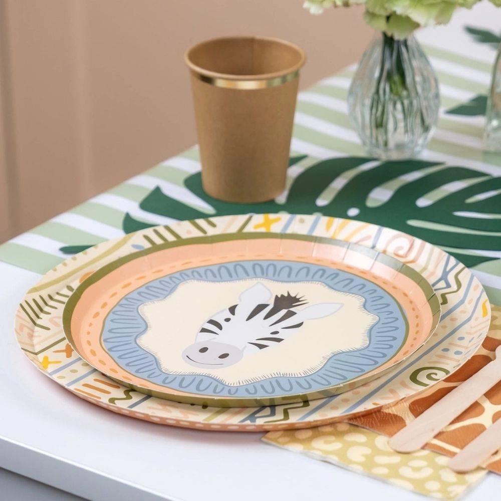 sage striped table runner with jungle party decor and safari tableware.