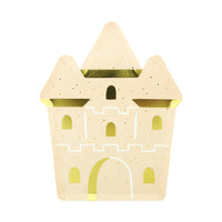 Sandcastle shaped paper plate in speckled sand cardstock with gold foil windows, turret trim, and an arched drawbridge, shown on a white background.