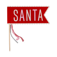 Red ‘Santa’ felt pennant with scalloped edge and ribbon tails on wood dowel.