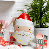 Inflated Santa Mylar Balloon displayed with Christmas decor and gifts