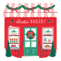 Storefront shaped Christmas jigsaw puzzle of a red Santa’s Bakery with a pink striped awning, garland, a green door with a wreath and windows full of gingerbread cookies, cakes and bread