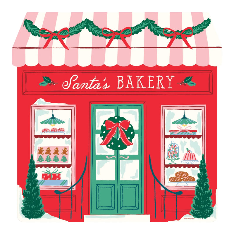 Storefront shaped Christmas jigsaw puzzle of a red Santa’s Bakery with a pink striped awning, garland, a green door with a wreath and windows full of gingerbread cookies, cakes and bread