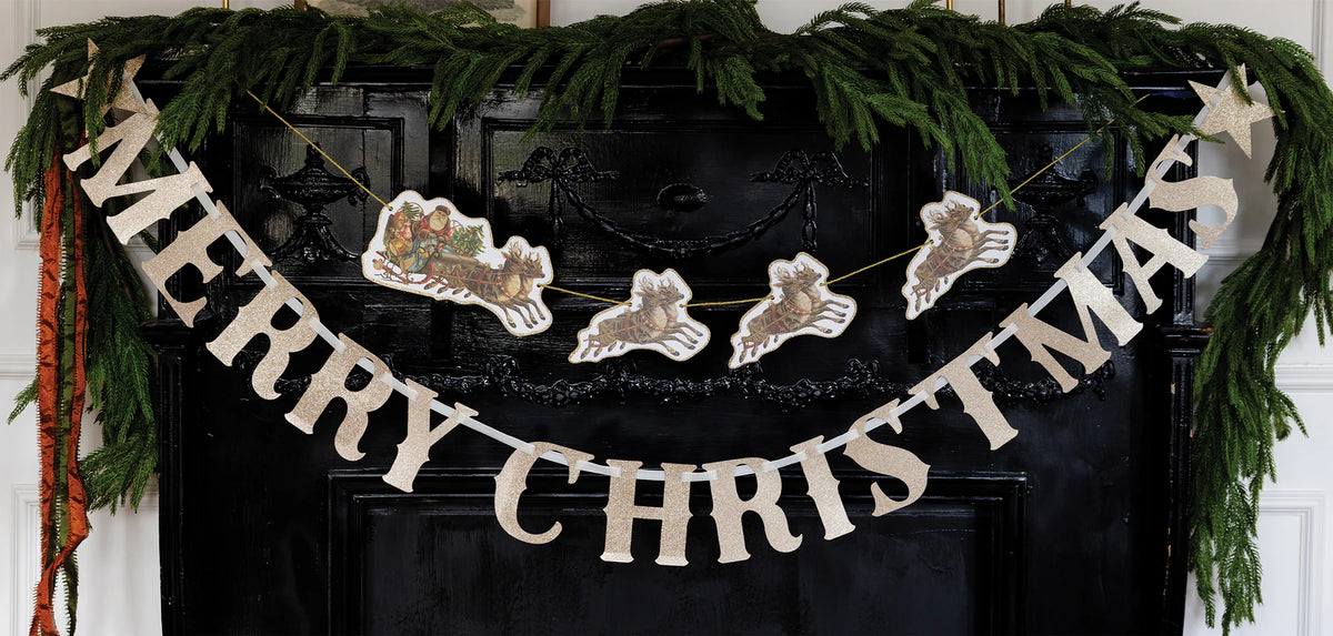 Close-up of Santa and flying reindeer on gold cord with glitter trim.