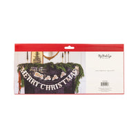 Vintage Santa’s sleigh Christmas banner styled over greenery as a Christmas mantle garland.