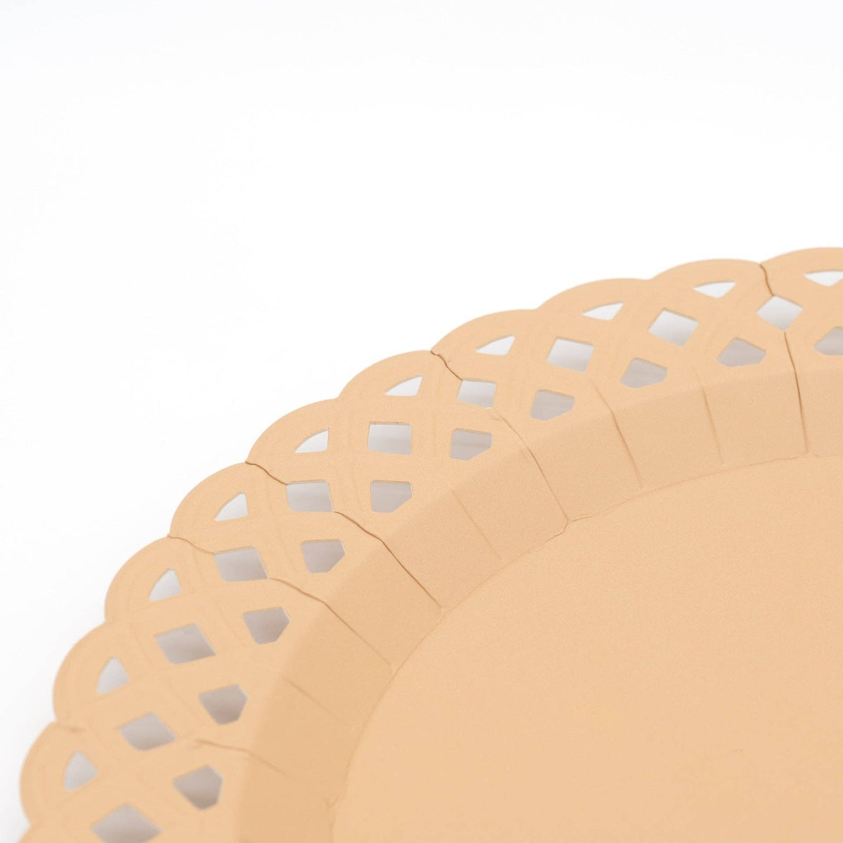 Close up vertical crop focusing on the die-cut scalloped edge and lattice texture of the paper charger plate.