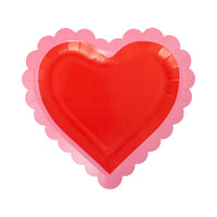 Scalloped heart shaped paper plate in red with pink border