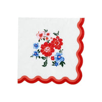 Single flat 5-inch floral napkin showing the red wavy scalloped edge detail on two sides.