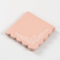 Stack of pink scalloped floral napkins