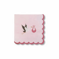 Single pink cocktail napkin with a scalloped edge and stork illustration