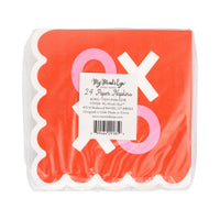 Stack of scalloped XOXO napkins with red, pink, and cream design