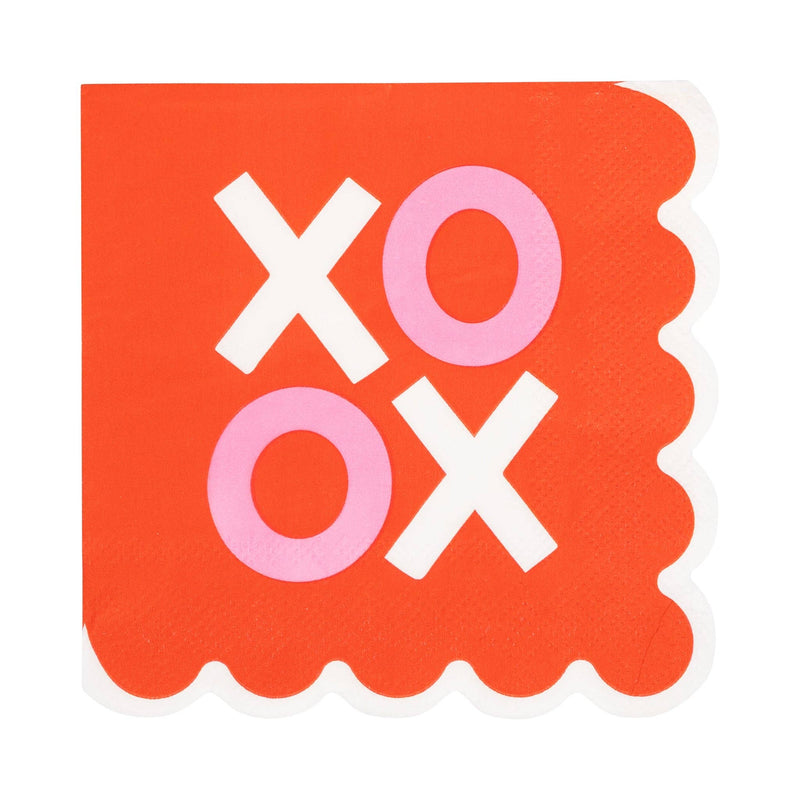 Scalloped XOXO cocktail napkin with red background and pink and white lettering