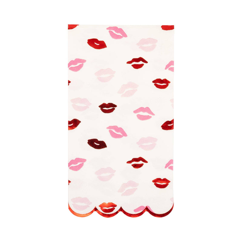 White dinner napkin with scattered pink and red lips and scalloped edge