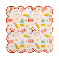 Close-up of school supplies scalloped paper plate showing cream background with retro school icons and red scalloped border
