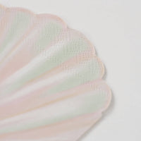 detail of scalloped edge on sea shell napkins.