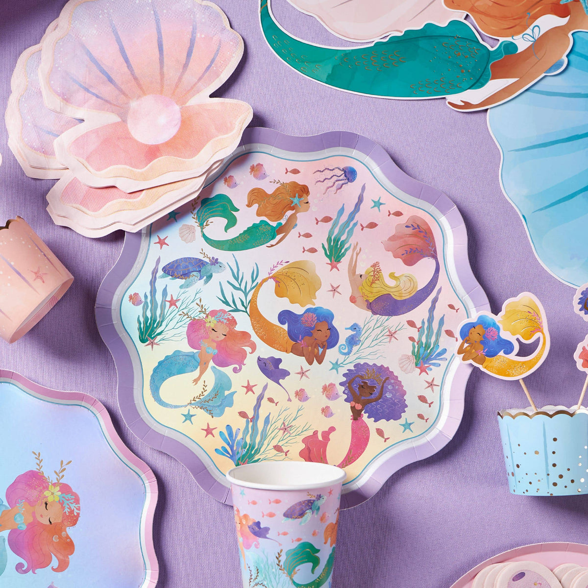 Seashell napkins with a mermaid plate, shell plates and mermaid toppers