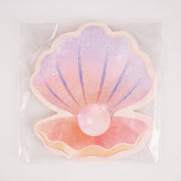Pastel pearl seashell shaped napkin in packaging