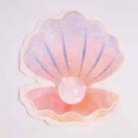 Single die-cut pastel seashell paper napkin with a pearl on white