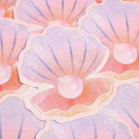 Stack of iridescent pastel seashell paper napkins showing the pearl and ombre