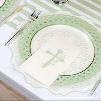 A serene secret garden table arrangement with white ranunculus centerpieces and botanical cross place settings.
