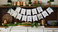 Sheet music Merry Christmas banner styled on a console with greenery