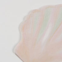 close up of shell party napkins with textured paper detail.