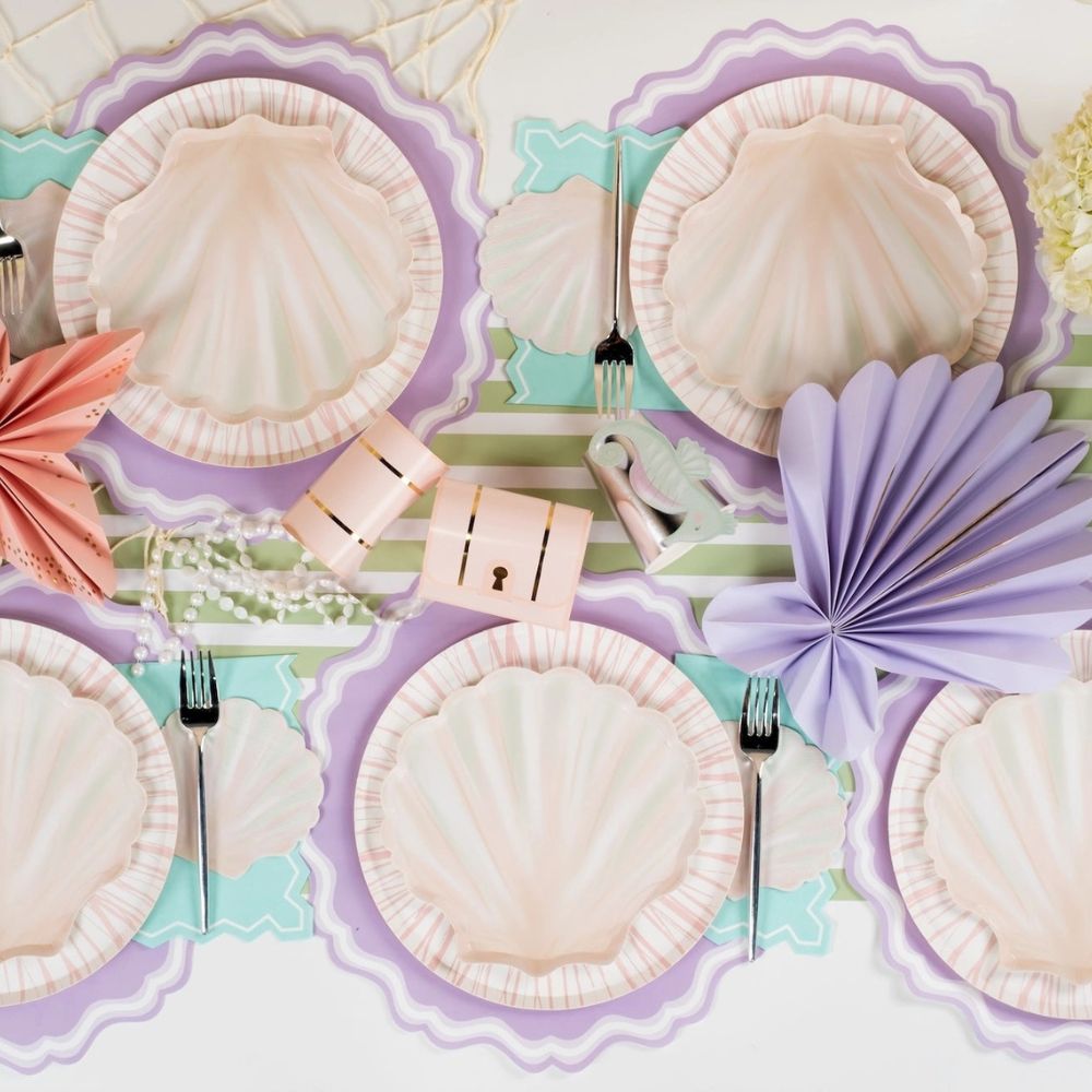shell party plates displayed with full mermaid themed table setting.