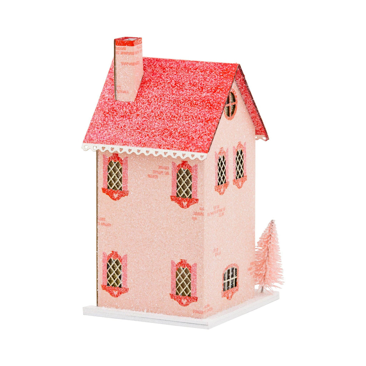 Side view of the assembled sweet shoppe lighted paper house showing the pink glitter and window details.