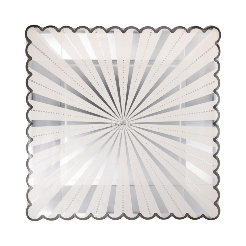 Angled view of the silver starburst square paper dinner plate